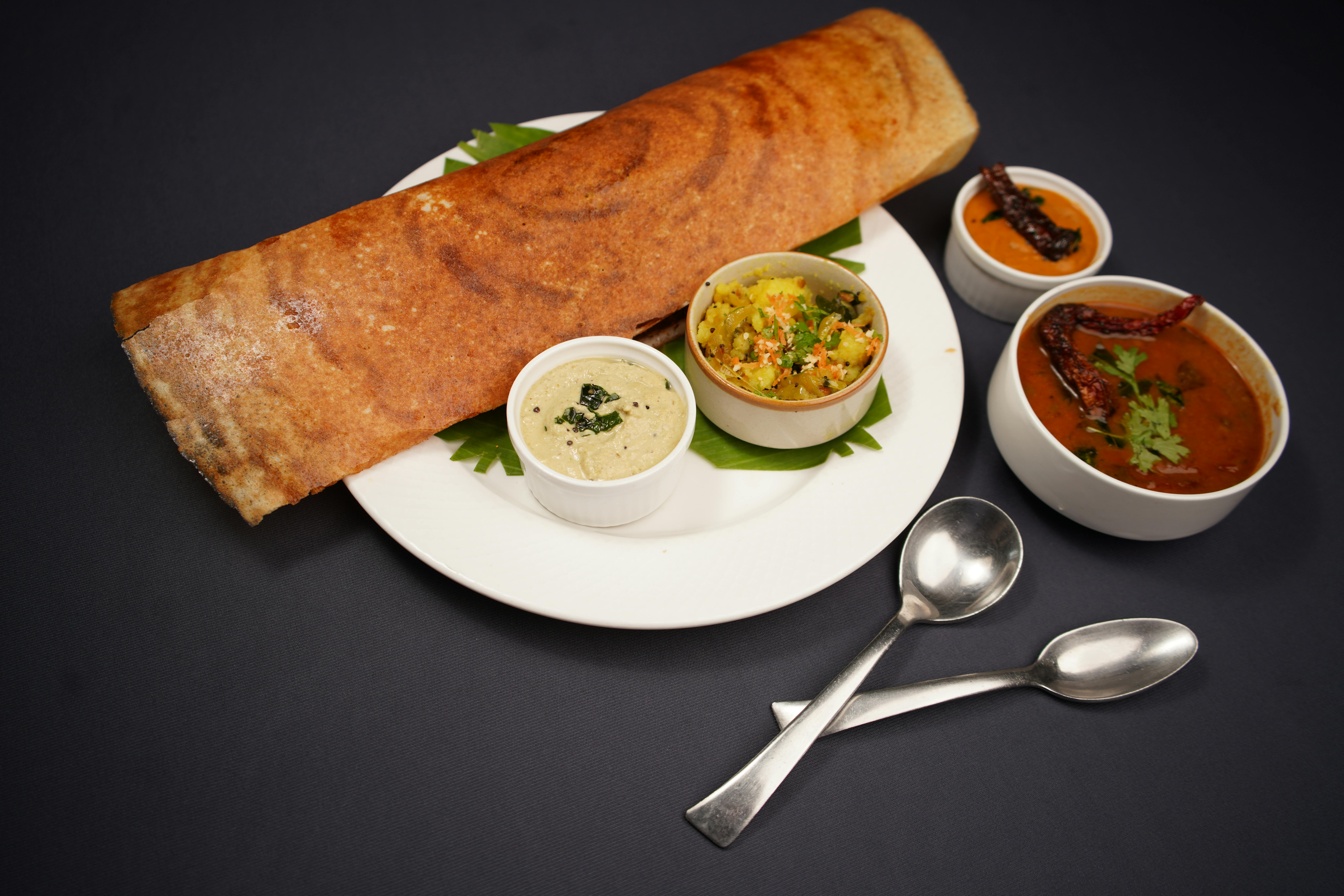Vegetarian Options to Look For in an Indian Restaurant 3 - Darbar Wenty Close-up of golden crispy dosa with coconut chutney and lentil sambar
